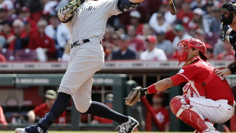 May 20, 2023; Cincinnati, Ohio, USA; New York Yankees center fielder Aaron Judge (99) hits an RBI single against the Cincinnati Reds during the third inning at Great American Ball Park. Mandatory Credit: David Kohl-USA TODAY Sports