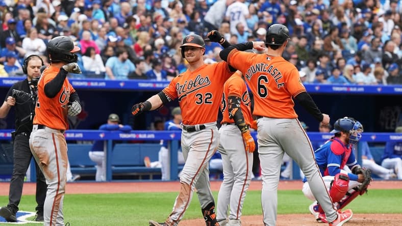 May 20, 2023; Toronto, Ontario, CAN; Baltimore Orioles designated hitter Ryan O'Hearn (32) celebrates after hitting a three-run home run with first baseman Ryan Mountcastle (6) against the Toronto Blue Jays during the eighth inning at Rogers Centre. Mandatory Credit: Nick Turchiaro-USA TODAY Sports