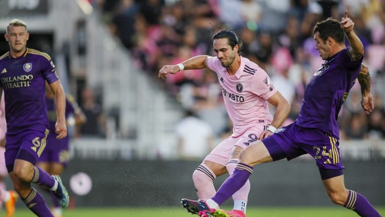 May 20, 2023; Fort Lauderdale, Florida, USA; Orlando City defender Kyle Smith (24) and Inter Miami CF forward Leonardo Campana (9) battle for possession during the first half at DRV PNK Stadium. Mandatory Credit: Sam Navarro-USA TODAY Sports