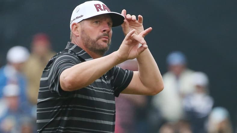 Michael Block tips his hat and waves to the loud supportive crowd following his par on the 18th hole during the third round at the PGA Championship at Oak Hill Country Club Saturday, May 20, 2023. Block finished the day tied for eighth at even par.