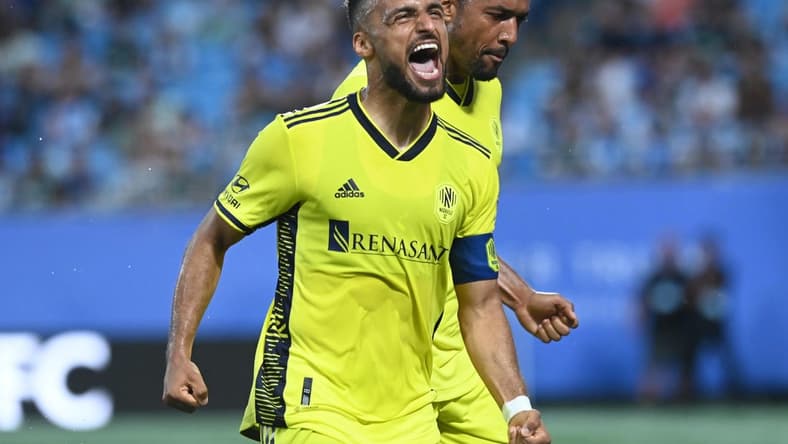 May 20, 2023; Charlotte, North Carolina, USA; Nashville SC midfielder Hany Mukhtar (10) celebrates his goal scored in the first half against Charlotte FC to tie the score 1-1 at Bank of America Stadium. Mandatory Credit: Griffin Zetterberg-USA TODAY Sports