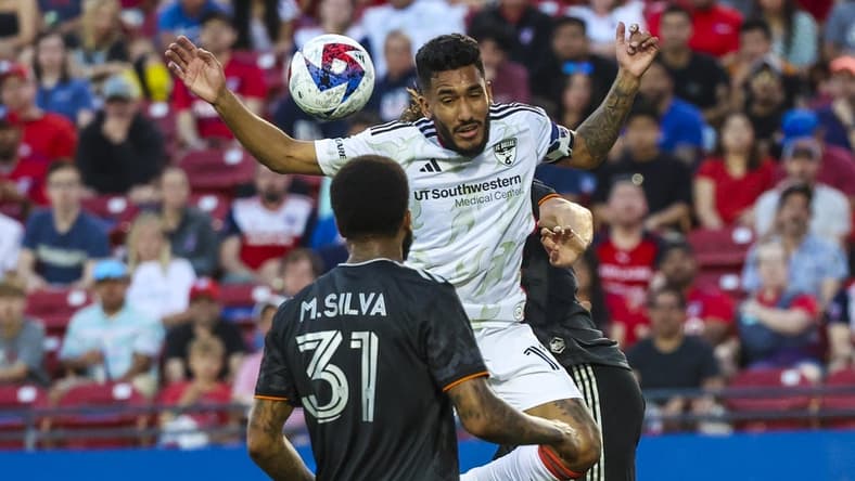 May 20, 2023; Frisco, Texas, USA;  FC Dallas forward Jesus Ferreira (10) tries to head a ball in front of Houston Dynamo defender Micael (31) during the first half at Toyota Stadium. Mandatory Credit: Kevin Jairaj-USA TODAY Sports