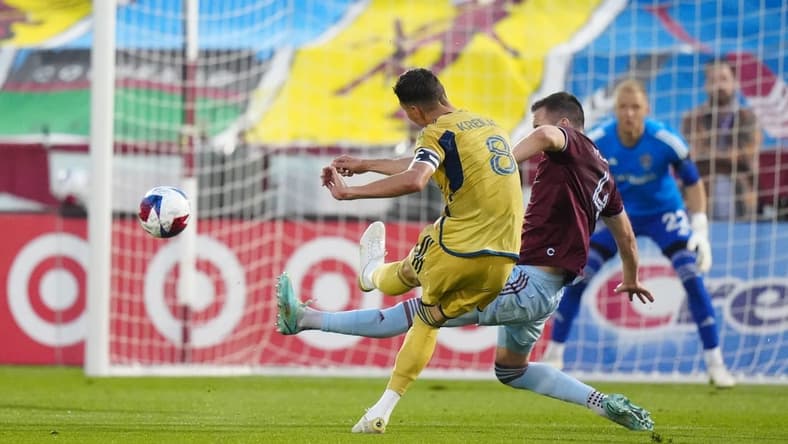 May 20, 2023; Commerce City, Colorado, USA; Real Salt Lake midfielder Damir Kreilach (8) takes a shot at goal against Colorado Rapids defender Danny Wilson (4) during the first half at Dick's Sporting Goods Park. Mandatory Credit: Ron Chenoy-USA TODAY Sports