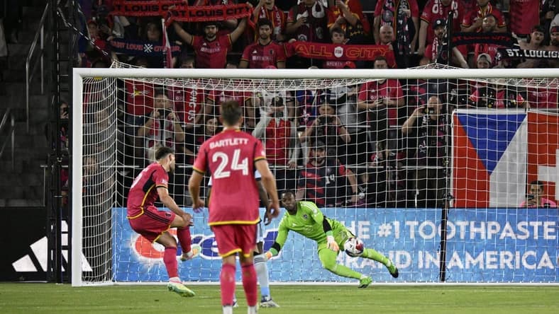 May 20, 2023; St. Louis, Missouri, USA; St. Louis City midfielder Eduard Lowen (10) scores the opening with a penalty kick during the first half against the Sporting Kansas City at CITYPARK. Mandatory Credit: Scott Rovak-USA TODAY Sports