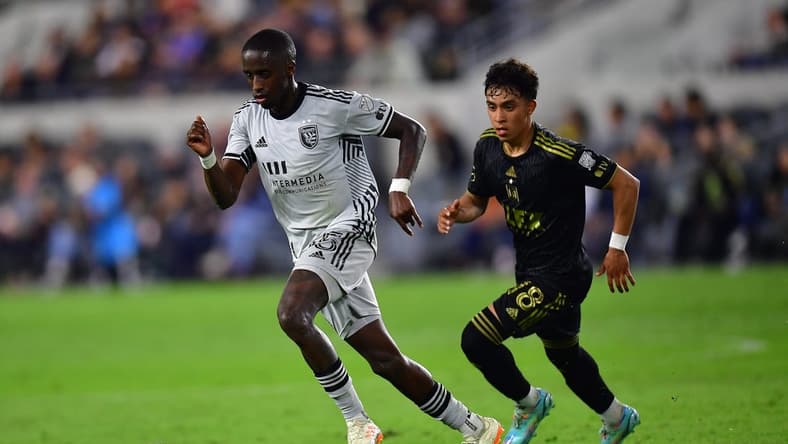 May 20, 2023; Los Angeles, California, USA; San Jose Earthquakes midfielder Jamiro Monteiro (35) controls the ball against Los Angeles FC defender Erik Duenas (18) during the first half at BMO Stadium. Mandatory Credit: Gary A. Vasquez-USA TODAY Sports