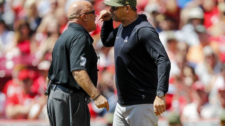 May 21, 2023; Cincinnati, Ohio, USA; New York Yankees manager Aaron Boone (17) argues with umpire Brian O'Nora (7) before being ejected after a play against the Cincinnati Reds in the first inning at Great American Ball Park. Mandatory Credit: Katie Stratman-USA TODAY Sports