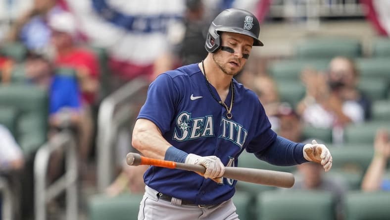 May 21, 2023; Cumberland, Georgia, USA; Seattle Mariners left fielder Jarred Kelenic (10) reacts after striking out against the Atlanta Braves during the ninth inning at Truist Park. Mandatory Credit: Dale Zanine-USA TODAY Sports