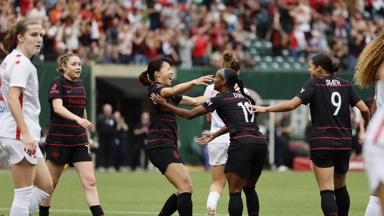May 21, 2023; Portland, Oregon, USA; Portland Thorns FC midfielder Crystal Dunn (19) celebrates a goal with midfielder Hina Sugita (8) in the first half against the Chicago Red Stars at Providence Park. Mandatory Credit: Soobum Im-USA TODAY Sports