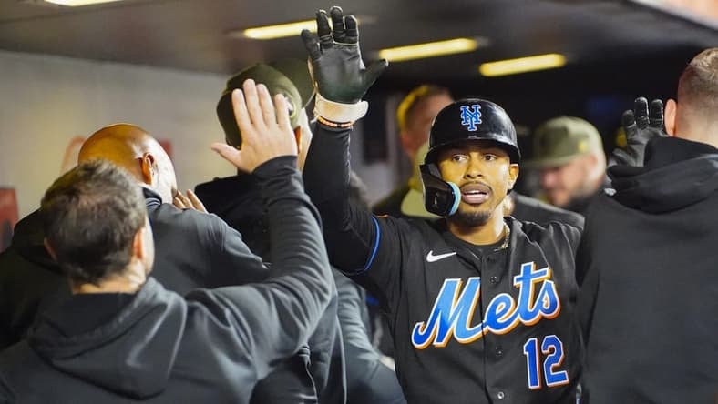 May 21, 2023; New York City, New York, USA; New York Mets shortstop Francisco Lindor (12) is congratulated by teammates after hitting a home run against the Cleveland Guardians during the sixth inning at Citi Field. Mandatory Credit: Gregory Fisher-USA TODAY Sports