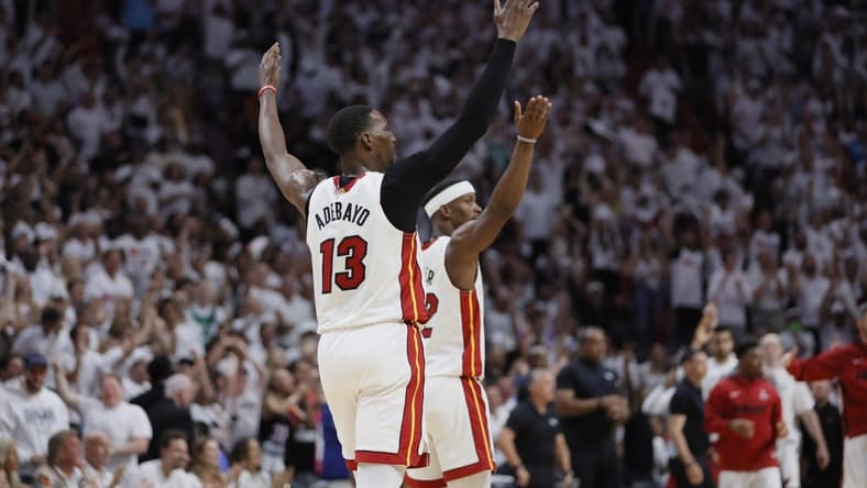 May 21, 2023; Miami, Florida, USA; Miami Heat center Bam Adebayo (13) and forward Jimmy Butler (22) react after a play during the third quarter against the Boston Celtics in game three of the Eastern Conference Finals for the 2023 NBA playoffs at Kaseya Center. Mandatory Credit: Sam Navarro-USA TODAY Sports