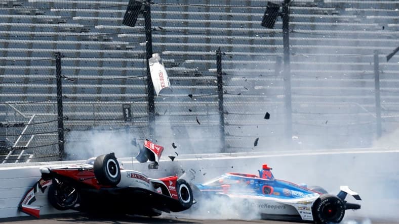 Rahal Letterman Lanigan Racing driver Katherine Legge (44) and Dreyer & Reinbold Racing driver Stefan Wilson (24) crash in the first turn Monday, May 22, 2023, during practice ahead of the 107th running of the Indianapolis 500 at Indianapolis Motor Speedway.
