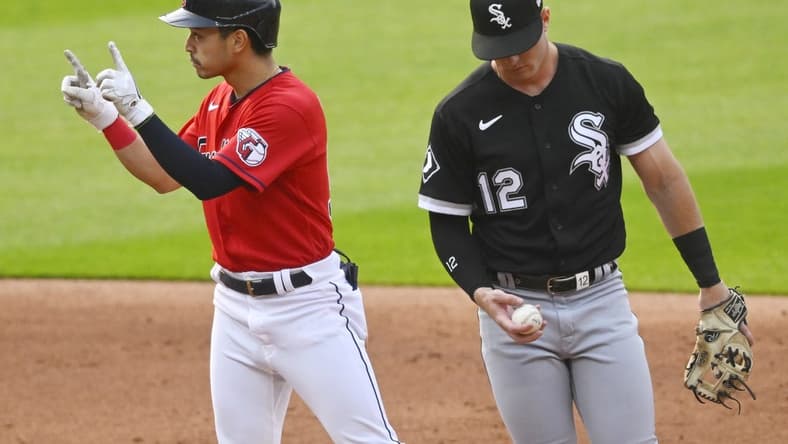 May 22, 2023; Cleveland, Ohio, USA; Cleveland Guardians left fielder Steven Kwan (38) celebrates his double beside Chicago White Sox second baseman Romy Gonzalez (12) in the third inning at Progressive Field. Mandatory Credit: David Richard-USA TODAY Sports