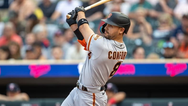 May 22, 2023; Minneapolis, Minnesota, USA; San Francisco Giants right fielder Michael Conforto (8) hits a three-run home run in the first inning against the Minnesota Twins at Target Field. Mandatory Credit: Jesse Johnson-USA TODAY Sports