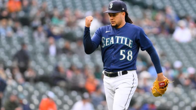 May 22, 2023; Seattle, Washington, USA; Seattle Mariners starting pitcher Luis Castillo (58) celebrates getting the final out of the first inning against the Oakland Athletics at T-Mobile Park. Mandatory Credit: Steven Bisig-USA TODAY Sports