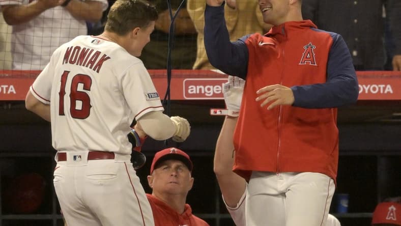 May 22, 2023; Anaheim, California, USA;  Los Angeles Angels center fielder Mickey Moniak (16) is greeted at the dugout after hitting a solo home run in the eighth inning against the Boston Red Sox at Angel Stadium. Mandatory Credit: Jayne Kamin-Oncea-USA TODAY Sports