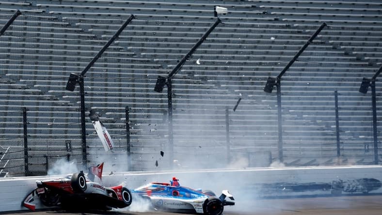Rahal Letterman Lanigan Racing driver Katherine Legge (44) and Dreyer & Reinbold Racing driver Stefan Wilson (24) crash in the first turn Monday, May 22, 2023, during practice ahead of the 107th running of the Indianapolis 500 at Indianapolis Motor Speedway.