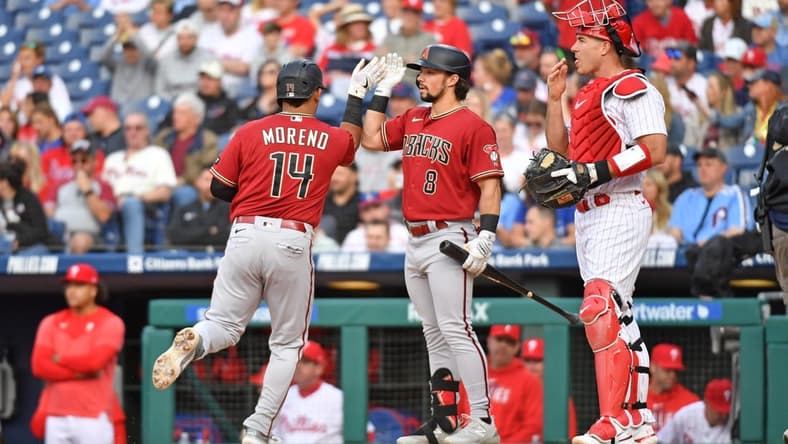 May 23, 2023; Philadelphia, Pennsylvania, USA; Arizona Diamondbacks catcher Gabriel Moreno (14) c elaborates his home run with right fielder Dominic Fletcher (8) during the second inning against the Philadelphia Phillies at Citizens Bank Park. Mandatory Credit: Eric Hartline-USA TODAY Sports