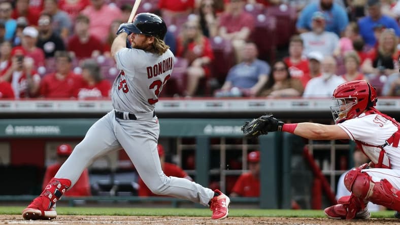 May 23, 2023; Cincinnati, Ohio, USA; St. Louis Cardinals first baseman Brendan Donovan (33) hits a single against the Cincinnati Reds during the second inning at Great American Ball Park. Mandatory Credit: David Kohl-USA TODAY Sports