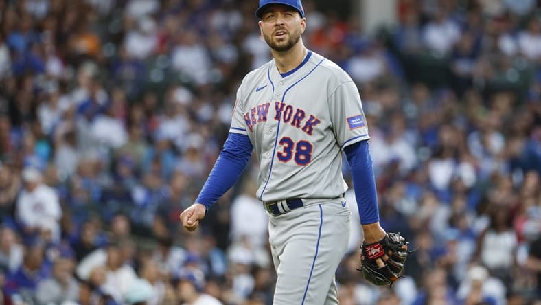 May 23, 2023; Chicago, Illinois, USA; New York Mets starting pitcher Tylor Megill (38) returns to dugout after pitching against the Chicago Cubs during the second inning at Wrigley Field. Mandatory Credit: Kamil Krzaczynski-USA TODAY Sports