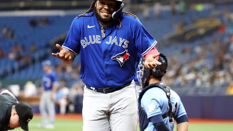 May 23, 2023; St. Petersburg, Florida, USA; Toronto Blue Jays first baseman Vladimir Guerrero Jr. (27) celebrates after he hit a grand slam against the Tampa Bay Rays during the ninth inning at Tropicana Field. Mandatory Credit: Kim Klement-USA TODAY Sports