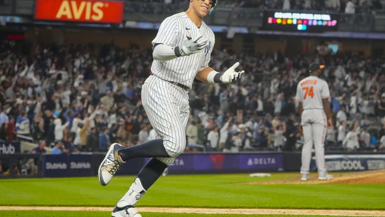 May 23, 2023; Bronx, New York, USA; New York Yankees right fielder Aaron Judge (99) reacts to hitting a home run against the Baltimore Orioles during the ninth inning at Yankee Stadium. Mandatory Credit: Gregory Fisher-USA TODAY Sports