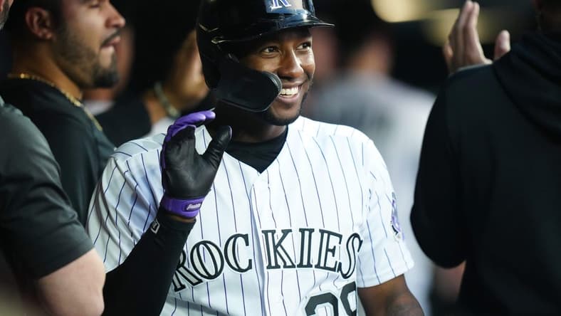 May 23, 2023; Denver, Colorado, USA; Colorado Rockies left fielder Jurickson Profar (29) celebrates scoring a run in the fifth inning against the Miami Marlins at Coors Field. Mandatory Credit: Ron Chenoy-USA TODAY Sports