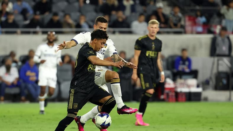 May 23, 2023; Los Angeles, CA, USA;  Los Angeles FC defender Erik Duenas (18) is fouled by Los Angeles Galaxy defender Calegari (2) during the first half of the the US Open Cup game at BMO Stadium. Mandatory Credit: Kiyoshi Mio-USA TODAY Sports