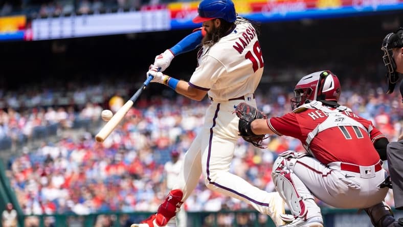 May 24, 2023; Philadelphia, Pennsylvania, USA; Philadelphia Phillies center fielder Brandon Marsh (16) hits a single during the fifth inning against the Arizona Diamondbacks at Citizens Bank Park. Mandatory Credit: Bill Streicher-USA TODAY Sports
