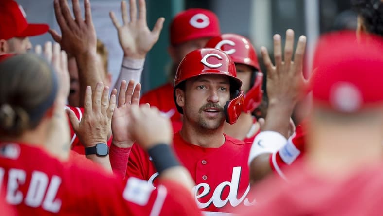 May 24, 2023; Cincinnati, Ohio, USA; Cincinnati Reds first baseman Spencer Steer (7) high fives teammates after scoring on a two-run single hit by catcher Tyler Stephenson (not pictured) in the first inning against the St. Louis Cardinals at Great American Ball Park. Mandatory Credit: Katie Stratman-USA TODAY Sports