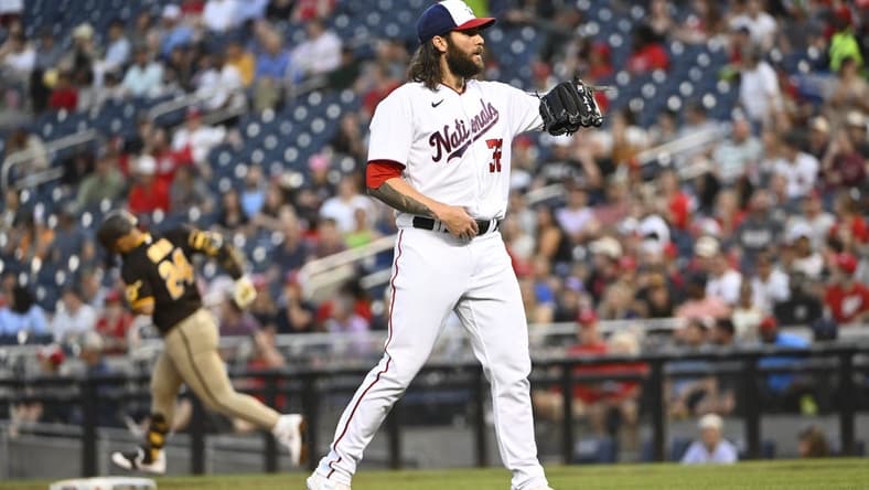 May 24, 2023; Washington, District of Columbia, USA; Washington Nationals starting pitcher Trevor Williams (32) reacts after giving up a two run home run to San Diego Padres second baseman Rougned Odor (24) during the fourth inning at Nationals Park. Mandatory Credit: Brad Mills-USA TODAY Sports