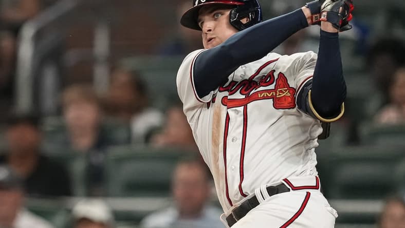May 24, 2023; Cumberland, Georgia, USA; Atlanta Braves third baseman Austin Riley (27) hits a double against the Los Angeles Dodgers during the ninth inning at Truist Park. Mandatory Credit: Dale Zanine-USA TODAY Sports