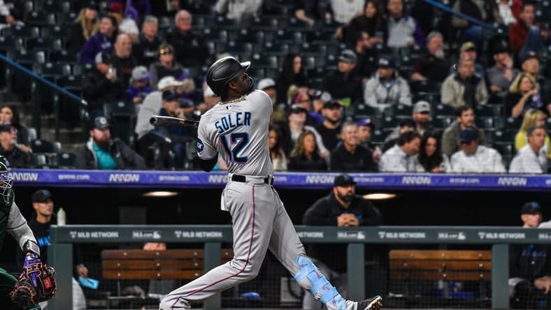 May 24, 2023; Denver, Colorado, USA; Miami Marlins right fielder Jorge Soler (12) hits a home run against the Colorado Rockies at Coors Field. Mandatory Credit: John Leyba-USA TODAY Sports