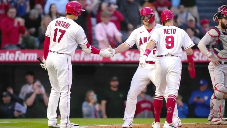 May 24, 2023; Anaheim, California, USA; Los Angeles Angels center fielder Mike Trout (27) celebrates with shortstop Zach Neto (9) and designated hitter Shohei Ohtani (17) after hitting a two-run home run in the fourth inning against the Boston Red Sox at Angel Stadium. Mandatory Credit: Kirby Lee-USA TODAY Sports