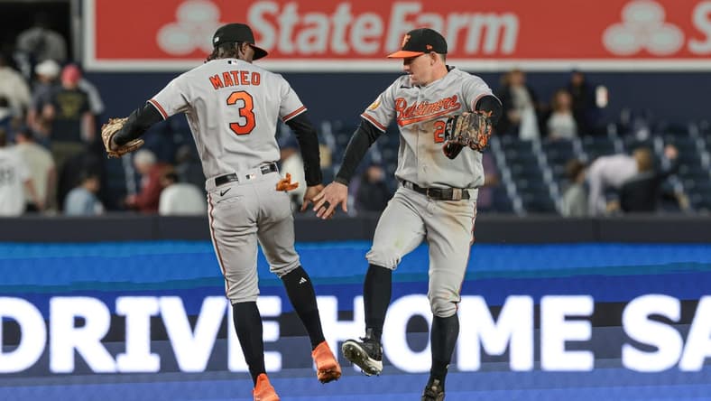May 24, 2023; Bronx, New York, USA; Baltimore Orioles shortstop Jorge Mateo (3) and left fielder Austin Hays (21) celebrate after defeating the New York Yankees at Yankee Stadium. Mandatory Credit: Vincent Carchietta-USA TODAY Sports