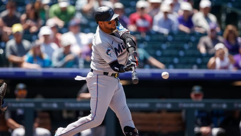 May 25, 2023; Denver, Colorado, USA; Miami Marlins first baseman Yuli Gurriel (10) this and RBI triple in the third inning against the Colorado Rockies at Coors Field. Mandatory Credit: Isaiah J. Downing-USA TODAY Sports