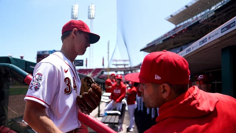 Cincinnati Reds first baseman Joey Votto congratulated Cincinnati Reds pitcher Luke Weaver (34) after he is pulled from the game in the seventh inning during a baseball game between the St. Louis Cardinals and the Cincinnati Reds, Thursday, May 25, 2023, at Great American Ball Park in Cincinnati.