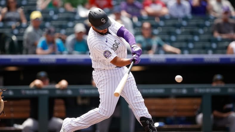 May 25, 2023; Denver, Colorado, USA; Colorado Rockies designated hitter Elias Diaz (35) hits a solo home run in the sixth inning against the Miami Marlins at Coors Field. Mandatory Credit: Isaiah J. Downing-USA TODAY Sports