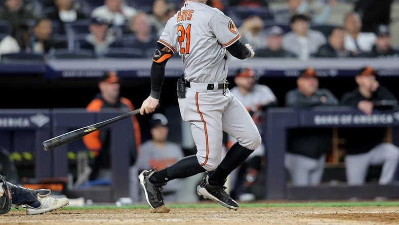 May 25, 2023; Bronx, New York, USA; Baltimore Orioles left fielder Austin Hays (21) follows through on a two run double against the New York Yankees during the eighth inning at Yankee Stadium. Mandatory Credit: Brad Penner-USA TODAY Sports