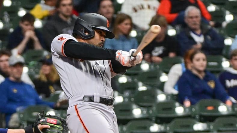 May 25, 2023; Milwaukee, Wisconsin, USA; San Francisco Giants first baseman LaMonte Wade Jr. (31) hits an RBI single in the fifth inning against the Milwaukee Brewers at American Family Field. Mandatory Credit: Benny Sieu-USA TODAY Sports