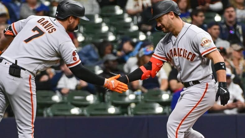 May 25, 2023; Milwaukee, Wisconsin, USA; San Francisco Giants right fielder Michael Conforto (8) is greeted by third baseman J.D. Davis (7) after hitting a solo home run in the eighth inning against the Milwaukee Brewers at American Family Field. Mandatory Credit: Benny Sieu-USA TODAY Sports