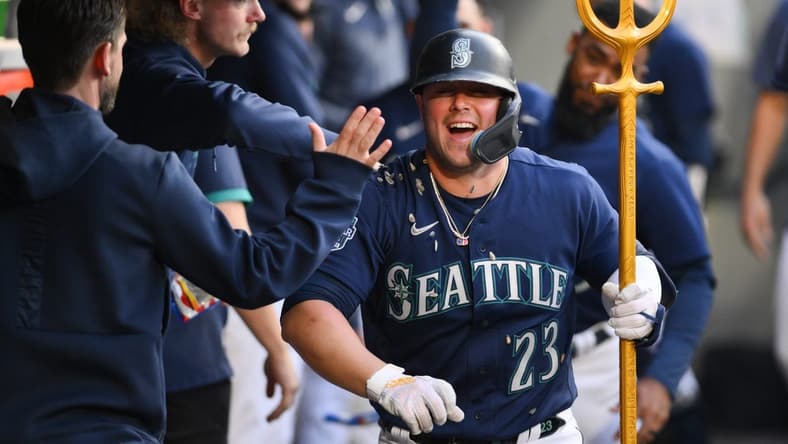 May 25, 2023; Seattle, Washington, USA; Seattle Mariners first baseman Ty France (23) celebrates in the dugout after hitting a home run against the Oakland Athletics during the sixth inning at T-Mobile Park. Mandatory Credit: Steven Bisig-USA TODAY Sports