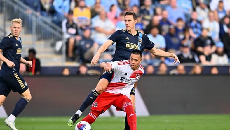 May 20, 2023; Philadelphia, Pennsylvania, USA; Philadelphia Union defender Jack Elliott (3) tackles New England Revolution forward Bobby Wood (17) in the first half at Subaru Park. Mandatory Credit: Kyle Ross-USA TODAY Sports