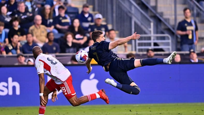 May 20, 2023; Philadelphia, Pennsylvania, USA; Philadelphia Union forward Mikkel Uhre (7) dives for the ball against New England Revolution defender Andrew Farrell (88) in the first half at Subaru Park. Mandatory Credit: Kyle Ross-USA TODAY Sports