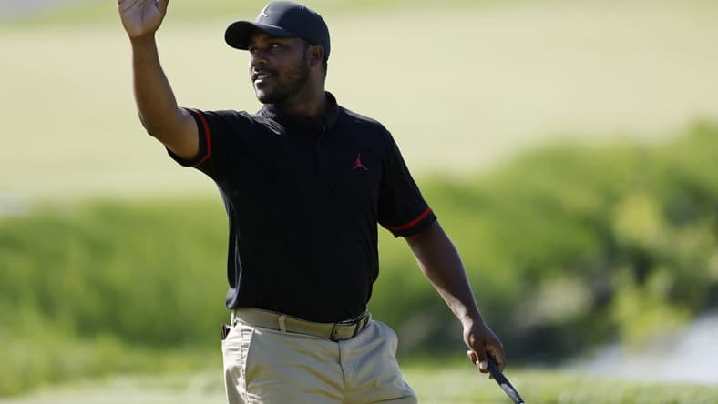 May 25, 2023; Washington, DC, USA; Harold Varner III waves to the crowd after making a birdie putt on the eighteenth hole during the first round of the LIV Golf DC 2023 tournament at Trump National Golf Club in Sterling, Va. Mandatory Credit: Geoff Burke-USA TODAY Sports