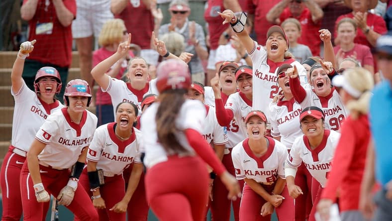 Oklahoma celebrates the home run of Oklahoma's Cydney Sanders (1) in the fourth inning during the NCAA Norman Super Regional softball game between the University of Oklahoma Sooners and the Clemson Tigers at Marita Hynes Field in Norman, Okla., Friday, May, 26, 2023.