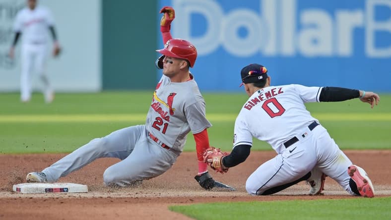 May 26, 2023; Cleveland, Ohio, USA; St. Louis Cardinals center fielder Lars Nootbaar (21) is caught stealing by Cleveland Guardians second baseman Andres Gimenez (0) during the third inning at Progressive Field. Mandatory Credit: Ken Blaze-USA TODAY Sports
