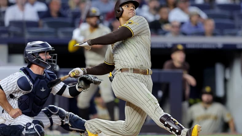 May 26, 2023; Bronx, New York, USA; San Diego Padres left fielder Juan Soto (22) follows through on a two run home run against the New York Yankees during the fifth inning at Yankee Stadium. Mandatory Credit: Brad Penner-USA TODAY Sports