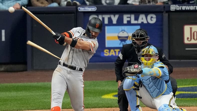 San Francisco Giants right fielder Michael Conforto (8) hits a broken bat single for an RBI during the sixth inning of their game against the Milwaukee Brewers Friday, May 26, 2023 at American Family Field in Milwaukee, Wis.