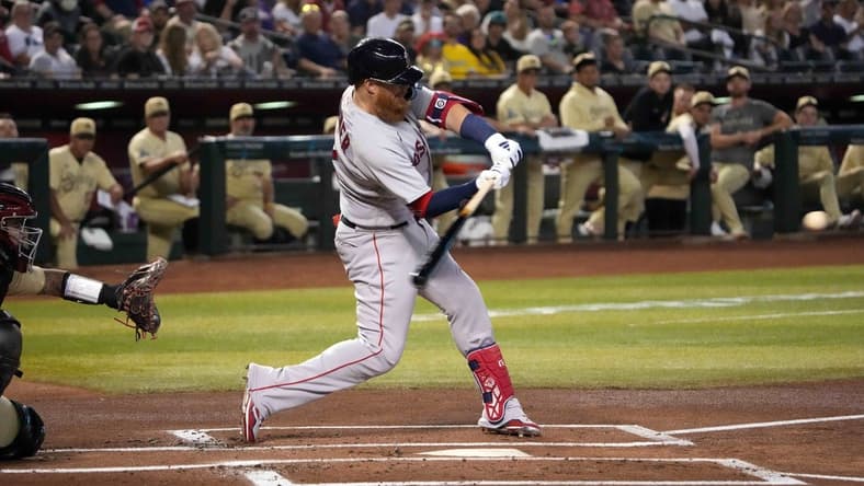 May 26, 2023; Phoenix, Arizona, USA; Boston Red Sox third baseman Justin Turner (2) hits a double against the Arizona Diamondbacks during the first inning at Chase Field. Mandatory Credit: Joe Camporeale-USA TODAY Sports