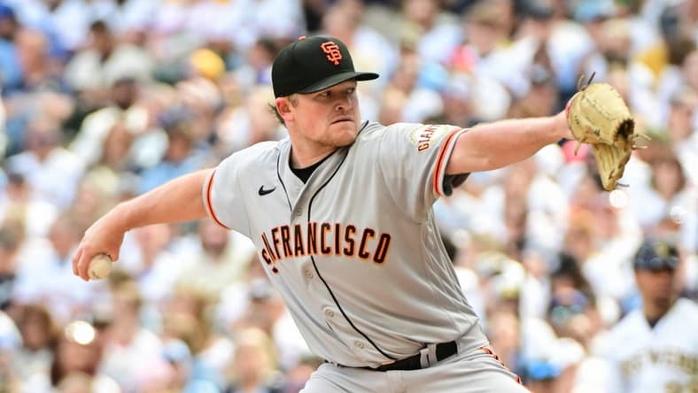 May 27, 2023; Milwaukee, Wisconsin, USA; San Francisco Giants pitcher Logan Webb (62) pitches against the Milwaukee Brewers in the first inning at American Family Field. Mandatory Credit: Benny Sieu-USA TODAY Sports